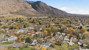View of mountain backdrop featuring nearby suburban area