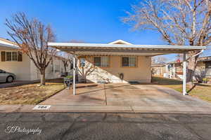 View of front of property featuring a carport