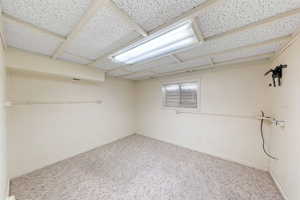 Finished basement featuring carpet floors and baseboards