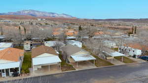 Aerial perspective of suburban area featuring a mountain backdrop