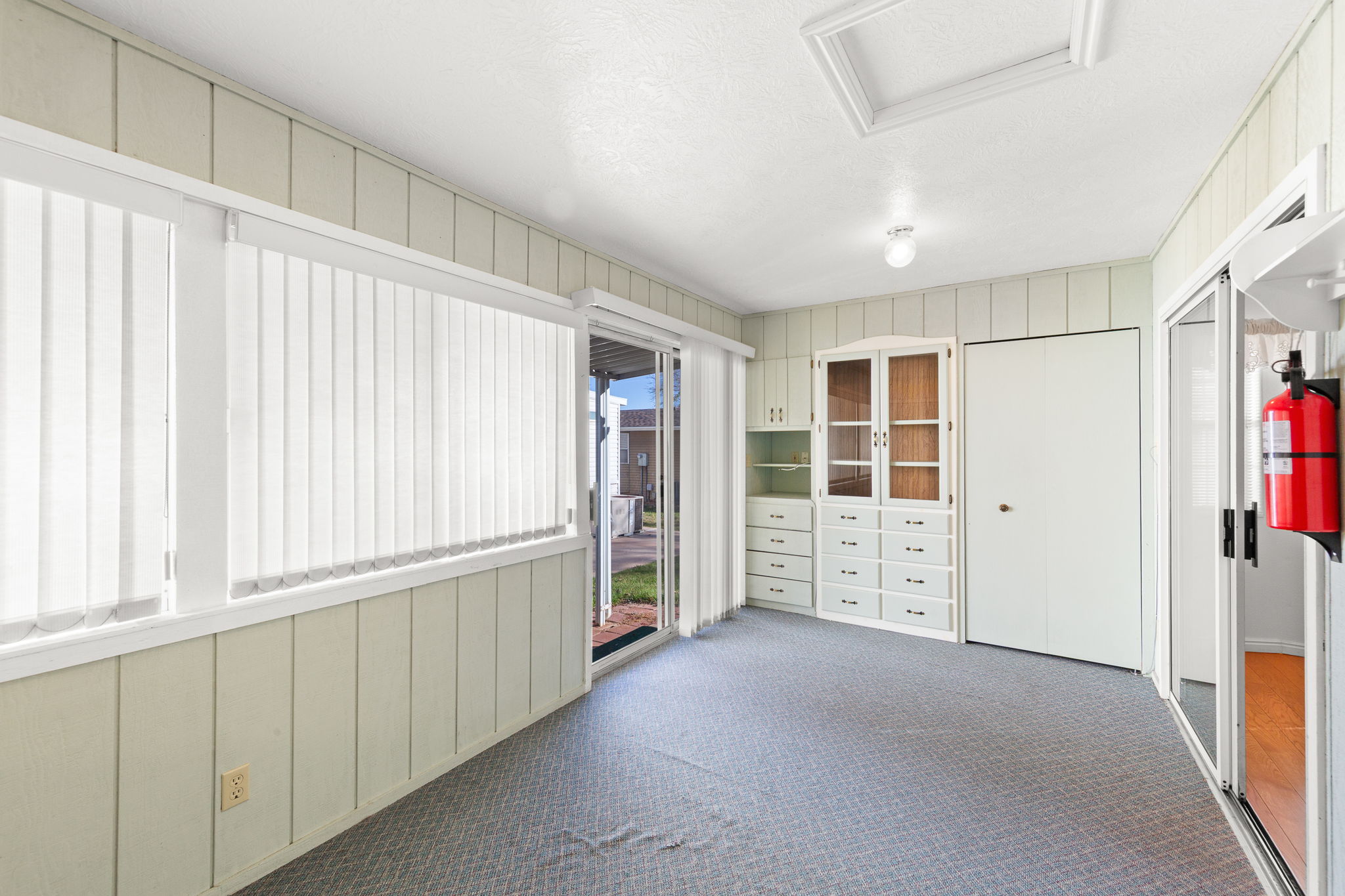 Unfurnished sunroom with french doors