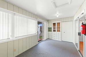 Unfurnished sunroom with french doors