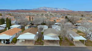 Aerial perspective of suburban area featuring a mountain backdrop