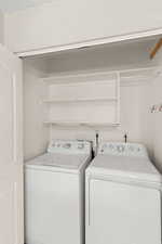 Washroom featuring washing machine and dryer