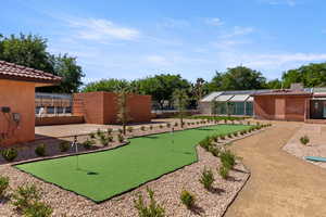 Surrounding community with an area to practice putting