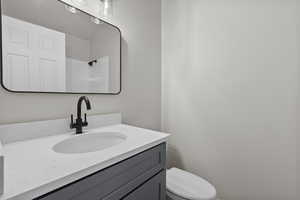 Bathroom featuring vanity and a shower