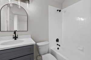 Full bathroom with vanity and shower / tub combination