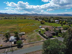 Aerial view of sparsely populated area with a mountain backdrop