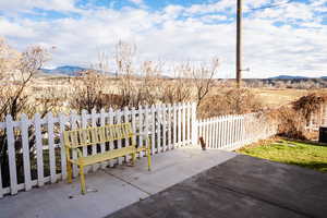 View of patio featuring a mountain view and a rural view