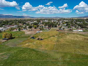 Aerial view of sparsely populated area with a mountain backdrop