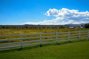 Gate featuring a rural view and a mountain view