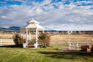 View of yard with a gazebo, a view of countryside, and a mountain view