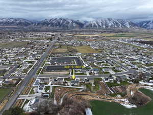 View of property location with a mountainous background and nearby suburban area