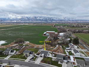 Aerial view of sparsely populated area featuring large plots for crops