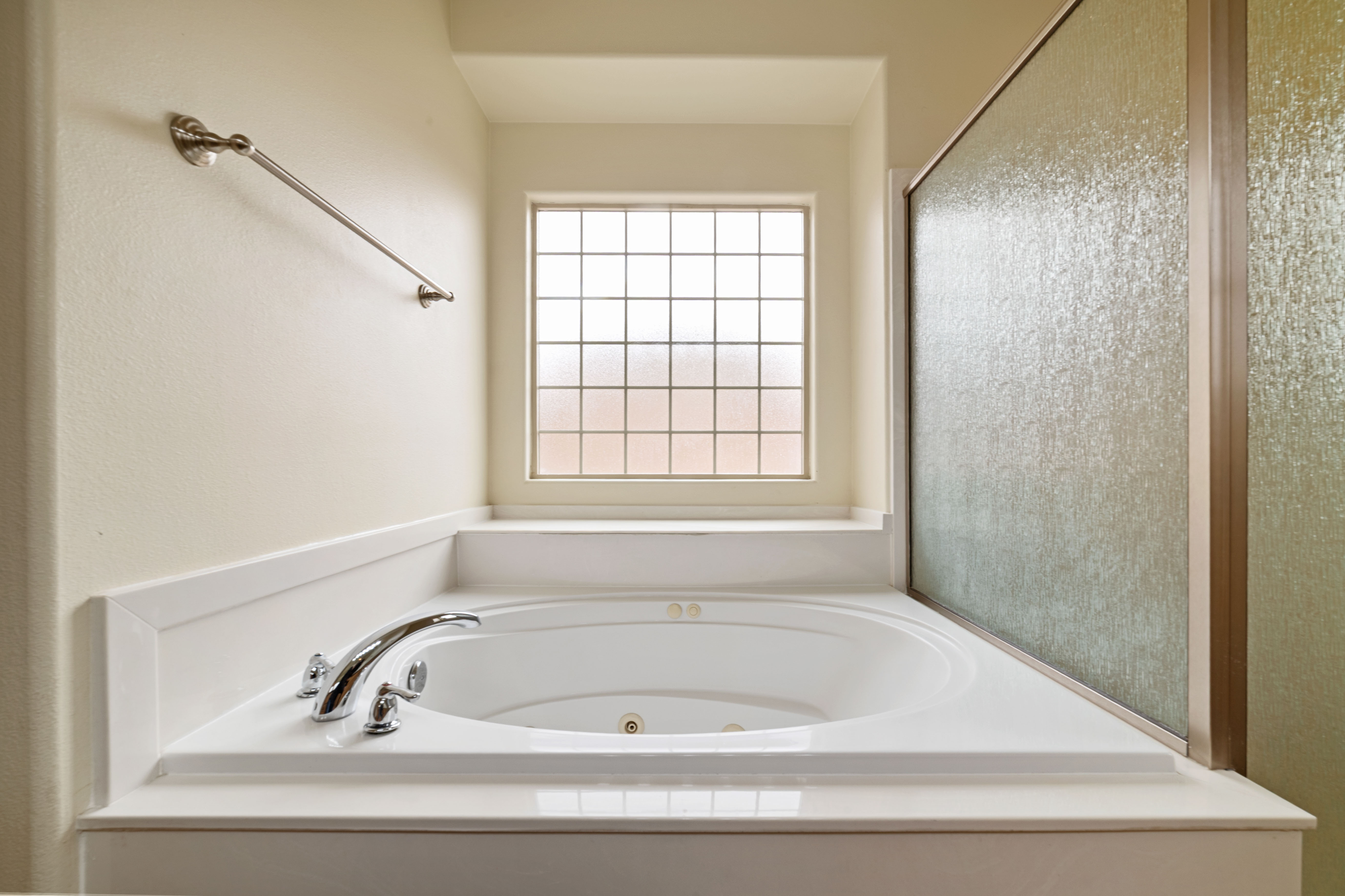 Full bath featuring a tub with jets