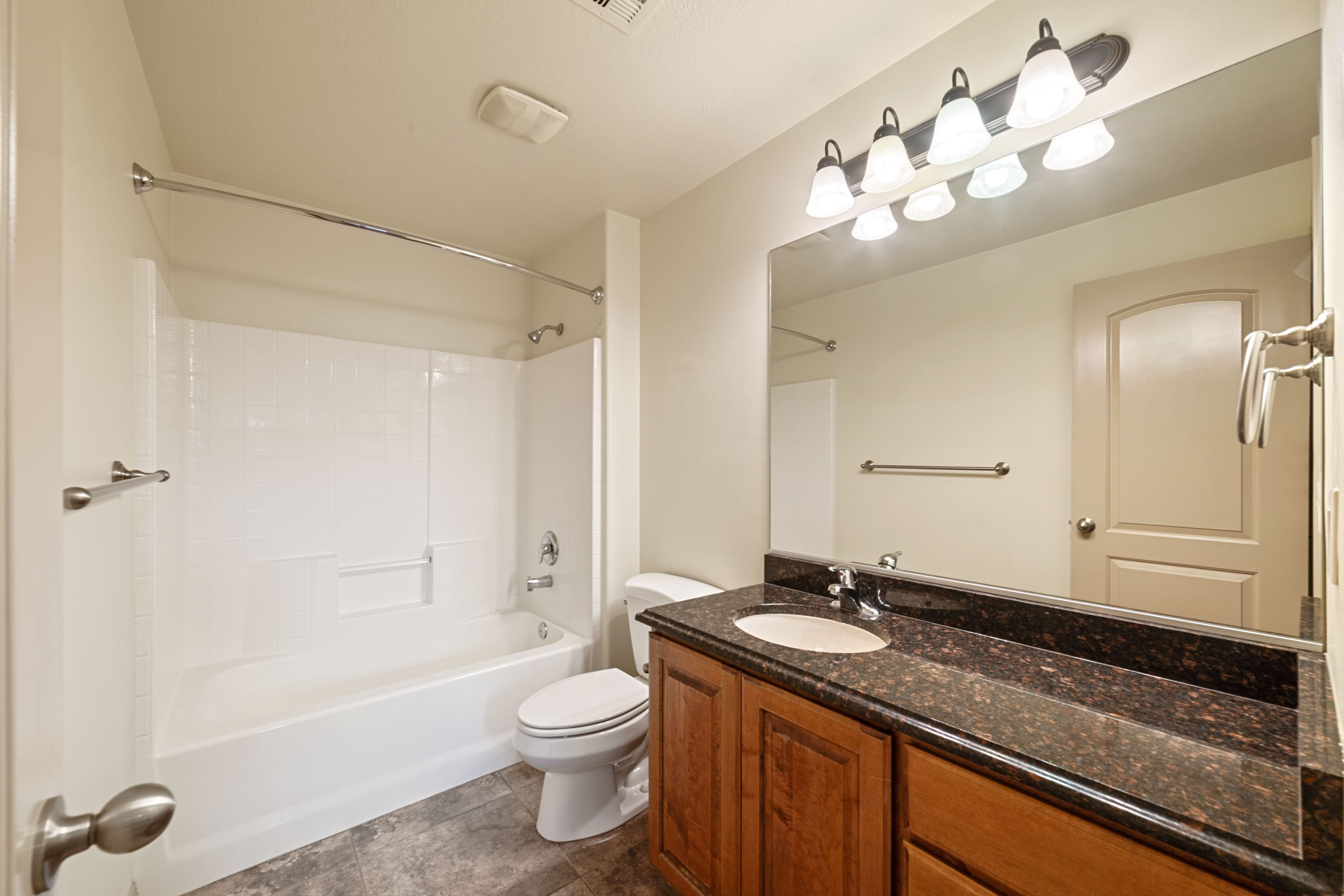 Bathroom featuring vanity and shower / bath combination