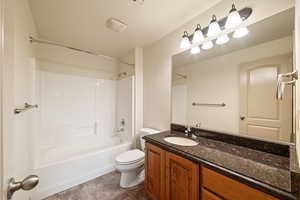 Bathroom featuring vanity and shower / bath combination