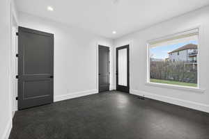 Unfurnished bedroom with recessed lighting