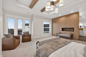 Carpeted bedroom featuring beamed ceiling, recessed lighting, a chandelier, a tray ceiling, and access to exterior