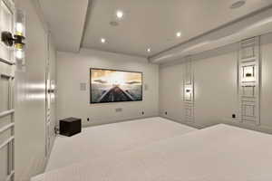 Home theater room with recessed lighting and carpet flooring