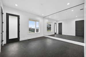 Unfurnished room with recessed lighting
