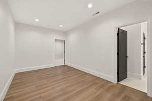 Unfurnished room featuring light wood-type flooring and recessed lighting