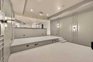 Cinema with recessed lighting and carpet floors