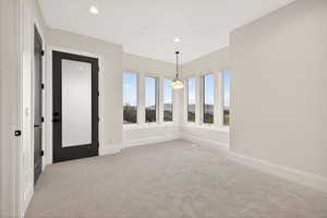 Spare room with light carpet and recessed lighting