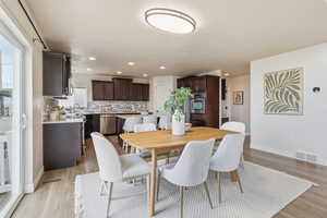 Dining space featuring recessed lighting and light wood finished floors