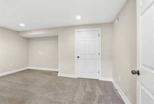 Basement featuring light carpet and recessed lighting