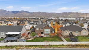 Aerial view of residential area featuring a mountainous background
