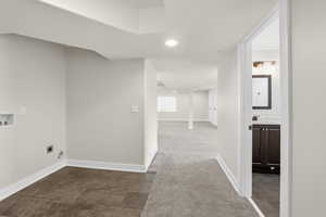 Washroom with dark colored carpet, recessed lighting, washer hookup, and electric dryer hookup