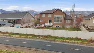 View of asphalt road with a mountain view and a residential view
