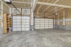 Garage featuring a garage door opener