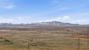 View of mountain background featuring rural landscape