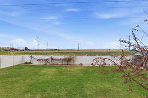 View of fenced backyard