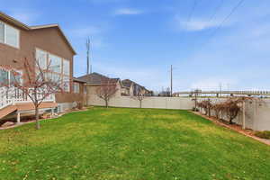 Fenced backyard with a residential view