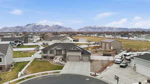 Aerial perspective of suburban area with a mountainous background
