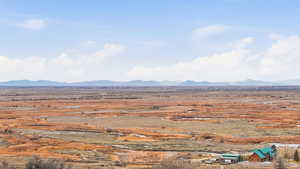 View of mountain backdrop featuring rural landscape
