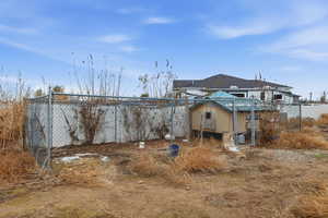 View of yard with exterior structure and an outbuilding