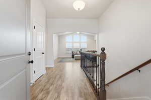 Foyer featuring light wood-style flooring and baseboards