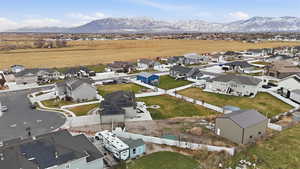 Aerial perspective of suburban area with a mountainous background