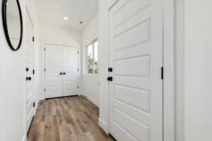 Entryway featuring wood finished floors and recessed lighting