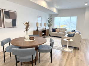 Dining space featuring light wood-style flooring and recessed lighting
