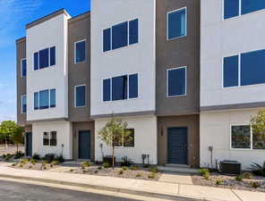 View of front of house with stucco siding