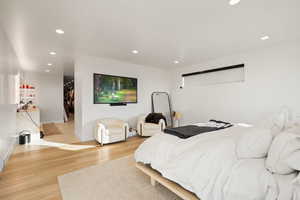 Bedroom featuring light wood finished floors and recessed lighting