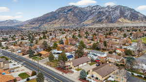 Aerial perspective of suburban area with a mountainous background