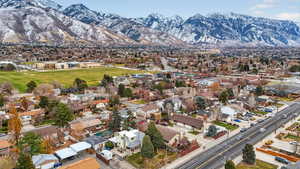 Aerial perspective of suburban area with a mountainous background