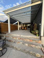 View of patio featuring a fire pit and a pergola
