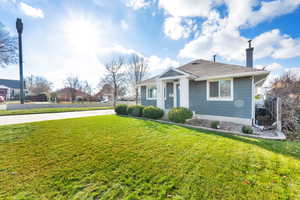 Bungalow-style house with a chimney and a shingled roof